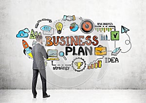 Rear view of businessman looking at business plan