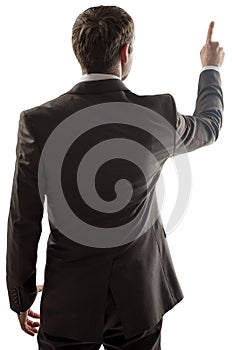 Rear view of businessman pointing at copy space