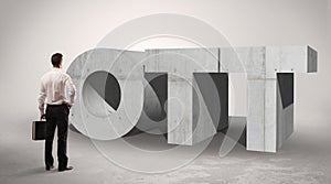 Rear view of a businessman standing in front abbreviation