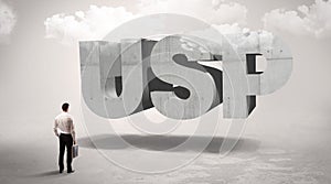 Rear view of a businessman standing in front abbreviation