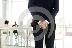Rear view businessman standing in modern office photo