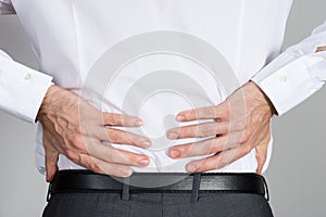 Rear View Of Businessman Suffering From Back Ache