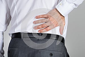 Rear View Of Businessman Suffering From Back Ache