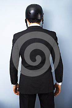 Rear view of businessman wearing helmet