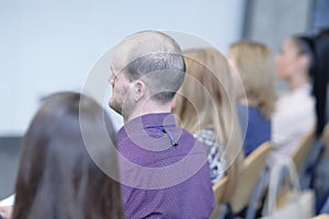 Rear view.businessmen sitting in a conference room