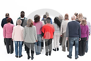 Rear view of a casual group of people looking on blank