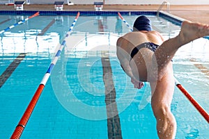 Swimmer plunging in the pool photo