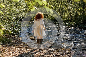 Rear View On Curly Redhead Lady Having Rest On River, Walking Alone