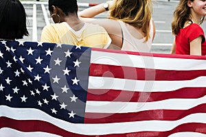 Rear view of diverse women group with American nation flag