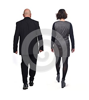 Rear view of a elegant couple walking on white background