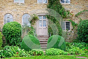 A rear view of an English country house from the garden