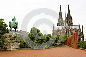 Rear view of Equestrian Statue of Kaiser Wilhelm II with Cologne Cathedral on the background, Germany photo