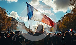 rear view of an event spectator waving a france flag