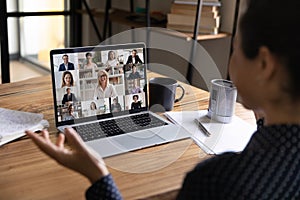 Woman have online team meeting with colleagues on laptop photo