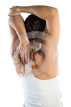 Rear view of female sportsperson exercising photo