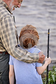 Rear View On Friendly Awesome Caucasian Child Boy Came To Fish With Grandfather