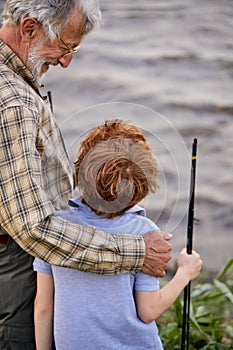 Rear View On Friendly Cute Caucasian Child Boy Came To Fish With Grandfather