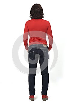 Rear view of a full portrait of a woman with casual clothes hands on pocket on white background