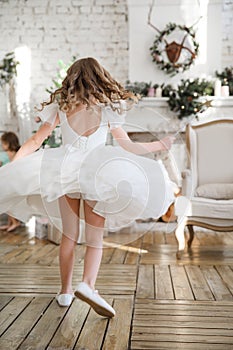 Rear view. girl on background of Christmas decor