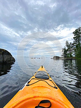 Rear view of kayaker man paddle kayak. Kayaking, canoeing, paddling