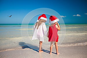 Rear view of Little cute girls in Christmas hats