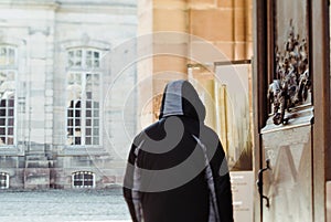 Rear view male silhouette walking in front of old vintage French