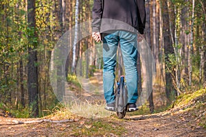 Rear view of a man on an electric unicycle photo