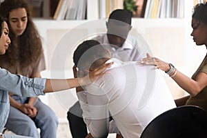 Rear view at man getting psychological support during therapy session