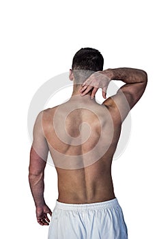 Rear view of a man suffering from neck pain