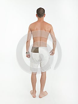 Rear view of man in swimming trunks