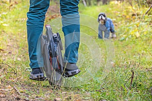 Rear view of men`s legs on an electric unicycle photo