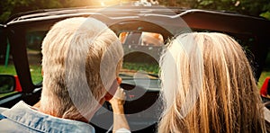 Rear view of mature couple going for ride together