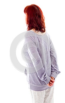 Rear view of a mature woman thinking with her hands behind back