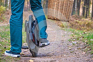 Rear view of men`s legs on an electric unicycle photo