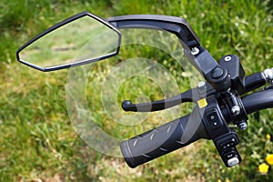 The rear view mirror of bicycle or scooter with closeup view