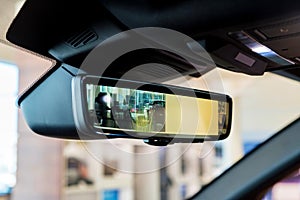 Rear view mirror in modern car with camera and display