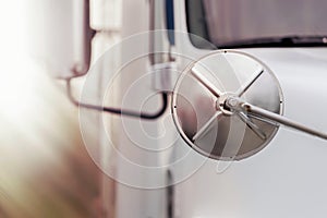 The rear view mirror of the truck close-up. trucking industry