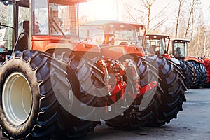 Rear view of modern agricultural tractors with hydraulic lifting frame for attaching trailed equipment