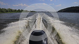 Rear view of motor speed boat with Water wake