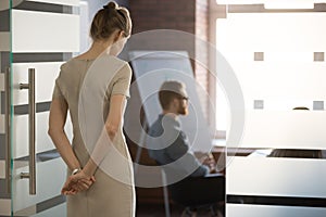 Rear view at nervous woman waiting preparing speech for meeting