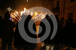 Rear view partecipants to the `Ndocciata`, evocative show of fire, heritage of Italy for tradition, Agnone, Molise, Italy