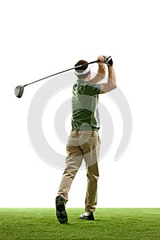 Rear view portrait of golfer in retro outfit with golf club taking shot against white studio background. Male golf