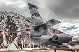 A rear view of a private jet in the airport of St Moritz Switzerland in the alps