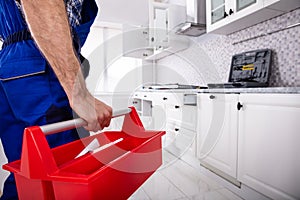 Repairman Holding Tool Box Installing Kitchen