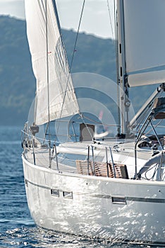 Rear view of Sailing yacht with white sails in the sea