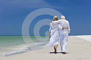 Rear View Senior Couple Walking on Tropical Beach