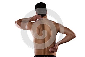 Rear view of shirtless sportsperson suffering from pain