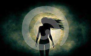 Rear view of silhouette ghost woman walking in the dark