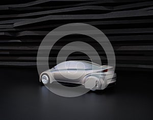 Rear view of silver autonomous car on abstract background