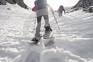 Rear view of snowshoeing woman